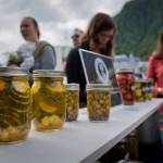 Kylie Wray, of Panhandle Produce, center, sells pickled vegetables during the Block Party at the Juneau Arts & Culture Center on Friday, June 15, 2018. (Michael Penn | Juneau Empire)