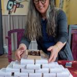 Marta Lastufka sets up her specialty chocolates during the Block Party at the Juneau Arts & Culture Center on Friday, June 15, 2018. (Michael Penn | Juneau Empire)