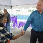 Dave Branding, CEO of JAMHI Health & Wellness, Inc., greets Angelina Lundy during an open house at JAMHIs Midtown Clinic located at the House First Project on Friday, June 22, 2018. (Michael Penn | Juneau Empire)