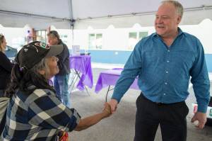 Dave Branding, CEO of JAMHI Health & Wellness, Inc., greets Angelina Lundy during an open house at JAMHIs Midtown Clinic located at the House First Project on Friday, June 22, 2018. (Michael Penn | Juneau Empire)