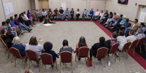 Participants gather to introduce themselves at the start of the Wisdom in the Circle meeting at Elizabeth Peratrovich Hall on Monday, June 25, 2018. The event is hosted by Tlingit & Haida, AWARE, and the Juneau Violence Prevention Coalition. (Michael Penn | Juneau Empire)