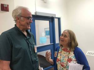 Best Starts for Juneau supporters Kevin Ritchie and Joy Lyon discuss the program outside of Assembly Chambers Monday, June 25. (Gregory Philson | Juneau Empire)