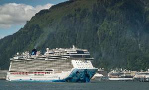 The Norwegian Bliss pulls out of Juneaus downtown harbor on Tuesday, June 12, 2018. (Michael Penn | Juneau Empire)
