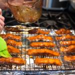 Erin Anais Heist prepares candied chum salmon at her home kitchen on Wednesday, June 27, 2018. (Michael Penn | Juneau Empire)