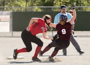 Gastineau Channel Little League shortstop Kaia Smith tags out Ketchikan Little Leagues Charlie King on Tuesday during Game 2 of a best-of-five series in the Alaska Little League District 2 Junior Softball Tournament at Dudley Field in Ketchikan. (Dustin Safranek | Ketchikan Daily News)