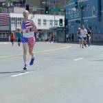A runner finishes the Glenn Frick Memorial Mile on Wednesday. (Nolin Ainsworth | Juneau Empire)