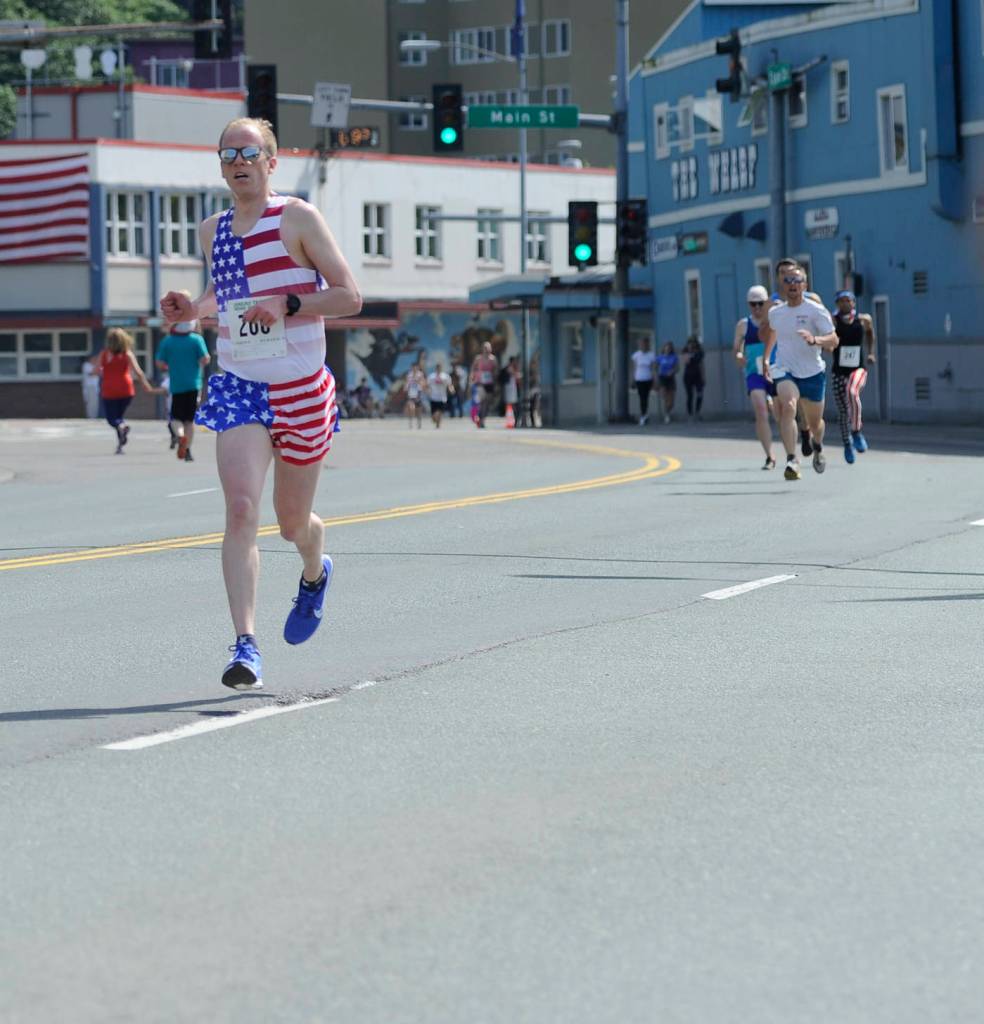 A runner finishes the Glenn Frick Memorial Mile on Wednesday. (Nolin Ainsworth | Juneau Empire)