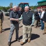 U.S. Secretary of Agriculture Sonny Perdue, right, shakes hands with owner Ray Keenan after touring Rollo Bay Holdings, which specializes in potato producing, marketing, shipping and exporting, in Souris, Prince Edward Island, Canada, on Friday, June 15, 2018. (Andrew Vaughan/The Canadian Press via AP)