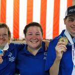 Nolan Harvey, right, shows off his gold medal with coach Tayvia Ruvane, center, and teammate Erica Pletting. (Courtesy Photo | Special Olympics Alaska)