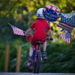 Alex Weiss is pictured riding his bike Wednesday, July 4, 2018. The Weiss family believes the bike, which won first place in the boys division of the Most Decorated Bicycle competition, was stolen after the annual Fourth of July parade in Douglas. (Derek Weiss | Courtesy Photo)