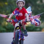 Alex Weiss is pictured riding his bike Wednesday, July 4, 2018. The Weiss family believes the bike, which won first place in the boys division of the Most Decorated Bicycle competition, was stolen after the annual Fourth of July parade in Douglas. (Derek Weiss | Courtesy Photo)