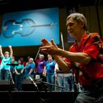 KTOOs Jeff Brown whips up the audience for the start of the 41st Annual Alaska Folk Festival at Centennial Hall on Monday. (Michael Penn | Juneau Empire File)