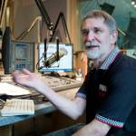 Jeff Brown talks Tuesday at KTOO about his newest project, fake event posters, to make people laugh. (Michael Penn | Juneau Empire File)