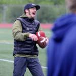 Former Western Oregon University receiver Paul Revis enjoys a lighter moment during the Football Skills, Strength and Speed Camp at Thunder Mountain High School on Wednesday. Revis set over 20 WOU school records, including most receptions, receiving yards, receiving touchdowns and all-purpose yards, in his time at WOU. (Nolin Ainsworth | Juneau Empire)