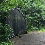 A soft-sided carport sits in the 9100 block of Cohen Drive on Wednesday, July 11, 2018. Law enforcement officials say pet carcasses were kept in this carport, and bears had begun to eat the carcasses. (Alex McCarthy | Juneau Empire)