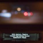 A new closed captioning is demonstrated at the 20th Century Theatre in downtown Juneau on Monday, July 16, 2018. Both closed captioning and assistive listening systems are available both downtown and their Glacier Cinemas in the Mendenhall Valley. (Michael Penn | Juneau Empire)