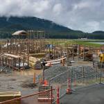 Construction crews continue the rebuilding of Project Playground at Twin Lakes on Monday, July 16, 2018. The Community portion of the build will be August 8 – 12, 2018. Built in 2007, the playground burned down in 2017. (Michael Penn | Juneau Empire)