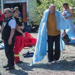 Capital City Fire/Rescue personnel care for victims who overturned their canoe during a guided trip on Mendenhall Lake on Friday, July 20, 2018. (Michael Penn | Juneau Empire)