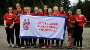 The Gastineau Channel Little League Major Softball all-stars pose with a state championships banner after defeating Anchorages Abbott-O-Rabbit, 7-5, to win the state championship on Saturday, July 14, 2018, at Melvin Park. (Nolin Ainsworth | Juneau Empire File)