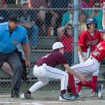 Gastineau Channels Kaleb Campbell is caught trying to steal home by Ketchikans Colby Hanchey in the fourth inning of the Alaska Major Baseball District 2 Championship Game at Miller Field on Tuesday. (Michael Penn | Juneau Empire)