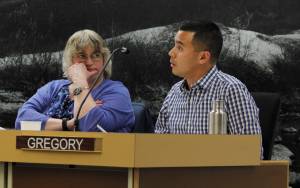 Assembly Member Norton Gregory shares a report during Monday nights City and Borough of Juneau Assembly meeting. Mayor Ken Koelsch selected Gregory as the chair of the citys new subcommittee to look into the future of mining in Juneau. Assembly member Beth Weldon (left) will also be on the committee. (Alex McCarthy | Juneau Empire File)