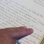 Archivist Zach Jones points out Wyatt Earps July 1900 application for a Nome liquour at the Alaska State Archives on Friday, July 27, 2018. (Michael Penn | Juneau Empire)