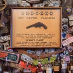 A framed gun said to have belonged to Wyatt Earp hangs at the Red Dog Saloon on Friday, July 27, 2018. (Michael Penn | Juneau Empire)