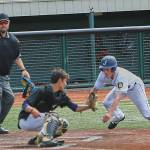 Juneau Post 25 shortstop Zeb Storie slides into home plate against South Post 4 in the American Legion state tournament at Mulcahy Stadium in Anchorage on Saturday. Juneau won 6-3. (Courtesy Photo | Jeremy Ludeman)