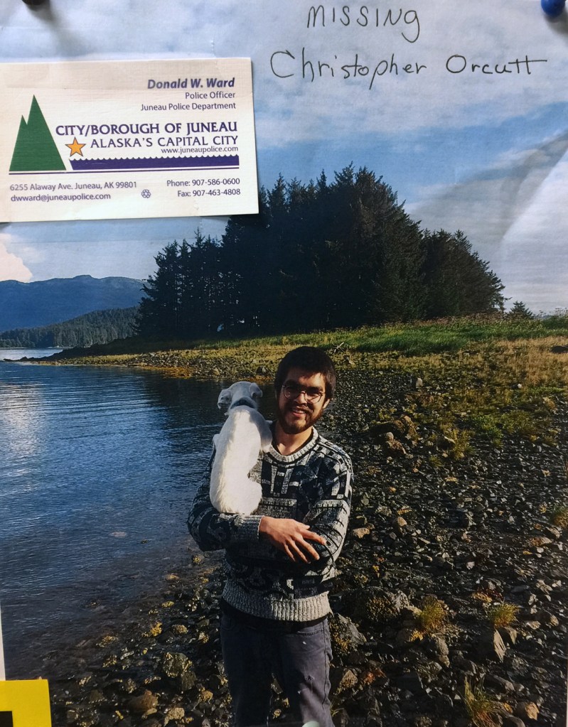 A "missing person" flier for Christopher Orcutt, seen hanging in Foodland IGA