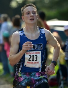 A Thunder Mountain High School runner dashes to the finish line Saturday, Aug. 27 during a cross country meet at Ward Lake in Ketchikan.
