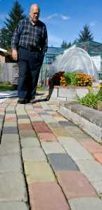 Alan Love made over 1000 colored bricks to decorate his backyard garden in the Mendenhall Valley.