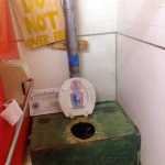 This June 2 photo shows a so-called honey bucket - a large bucket used as a toilet without running water - at the tribal council office in the village of Kipnuk. Flush toilets and running water remain elusive dreams for residents of at least 30 Alaska villages where indoor plumbing has historically cost hundreds of thousands of dollars to install in just one home.