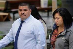 Raymond Fryberg, left, the father of the Washington state teenager who fatally shot four classmates and himself at Marysville-Pilchuck High School in October 2014, arrives at the federal courthouse in Seattle, Monday, Sept. 21, 2015. Fryberg is on trial this week for six counts of illegally possessing firearms, including the one used in the shooting, while under a domestic violence restraining order that meant he was not allowed to have guns. (AP Photo/Ted S. Warren)