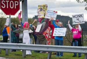 Juneau residents rally for Planned Parenthood at the corner of Egan and Channel Drives on Wednesday.