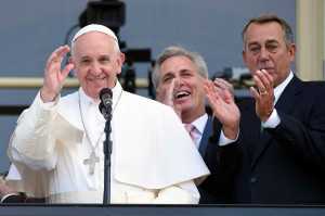 House Speaker John Boehner of Ohio becomes emotional as Pope Francis appears on the Speaker's Balcony on Capitol Hill, Thursday, Sept. 24, 2015 and waves to the waiting crowd below on the Capitol grounds. The pope addressed a joint meeting of Congress before stepping out on the balcony. Between the pope and Boehner is Majority Leader Kevin McCarthy of California. (AP Photo/Susan Walsh)