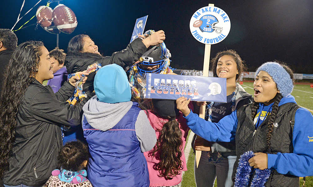 Thunder Mountain senior Ma'ake Ma'ake receives honors from family and friends during Friday's final home game for the Falcons.