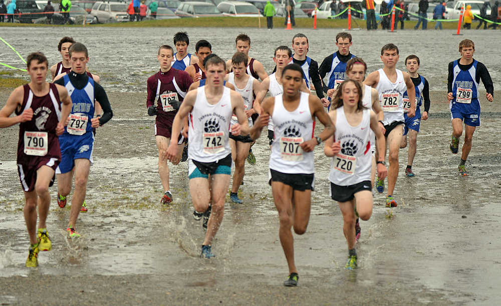 The 4A boys run at the start of the Region V championships on Saturday at Sandy Beach.