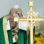 Pope Francis blesses the bread while preparing communion during Mass Sunday in Philadelphia.