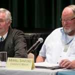 Juneau Assembly mayor candidates Greg Fish, left, and Merrill Sanford answer questions during the Juneau Votes! debate held at the University of Alaska Southeast on Tuesday. The candidates from the left are: Greg Fisk, Serrill Sanford, Loren Jones, Dixie Hood, Jerry Nankervis and Jason Puckett.