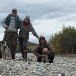 From left to right, Loki, Nils Dihle, Mary Catharine Martin, Bjorn Dihle and Fen pause for a photo shortly after shooting some rapids on the Big Salmon River.