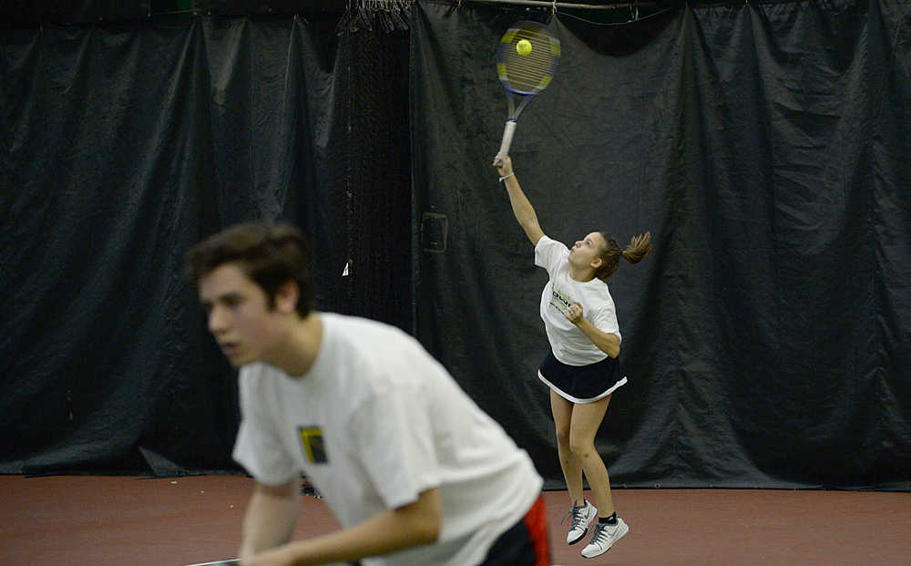 Juneau-Douglas High School freshman Erica Hurtte serves during the Region V tennis tournament at the JRC/The Alaska Club Valley on Thursday. Play continues today from 11:30 a.m. to 2:30 p.m.