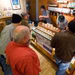 Employees of Amazon Organics, a pot dispensary in Eugene, Oregon, help customers purchase recreational marijuana on Thursday. Oregon marijuana shops began selling marijuana Thursday for the first time to recreational users who are at least 21 years old, marking a big day for the budding pot industry.