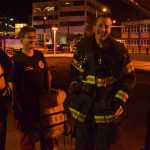 Firefighter Noah Jenkins, second from right, was the person who jumped in the water off the Alaska Steamship Dock on Tuesday evening, Oct. 6, 2015 in downtown Juneau to rescue a man who had fallen from the dock above.