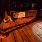 A Juneau Police Department officer speaks with bystanders who heard a man fall into the water off the Alaska Steamship Dock on Tuesday evening, Oct. 6, 2015. Water temperatures, according to NOAA, were 47.5 degrees.