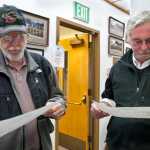 Assembly winners Loren Jones, left, and Greg Fisk read over election results in the Assembly Chambers Tuesday evening.
