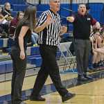 Referee James Mercer deals with Thunder Mountain coach Tanya Nizich and Ketchikan coach Kelly Smith expressing opposing views to a call during action last season.