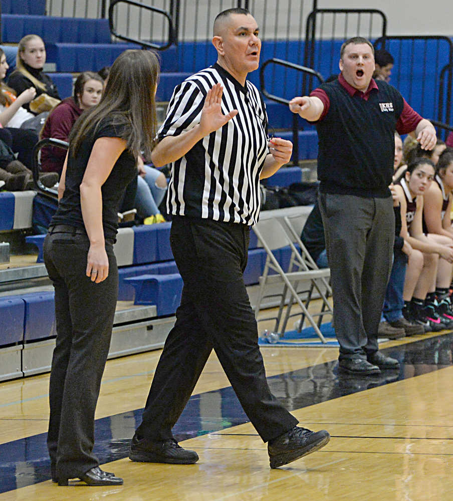 Referee James Mercer deals with Thunder Mountain coach Tanya Nizich and Ketchikan coach Kelly Smith expressing opposing views to a call during action last season.