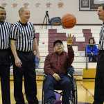 Longtime Gold Medal fan Steve Hanlin, from Hoonah, tosses the ceremonial first tip off to start last year's tournament. Fans like Hanlin made life easy for referees Manuel Fernandez, Steven Landro and Jason Crider. Hanlin is such a fan that he is ususally the first waiting in line before Gold Medal tournament volunteers arrive to the gym.
