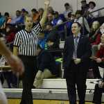 Referee Joel Osburn enjoys a light moment with Juneau-Douglas coach Robert Casperson during action last season.