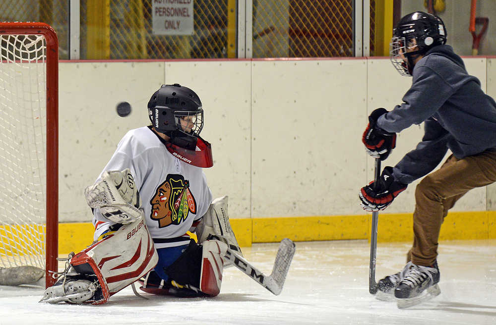 Floriane Wade makes a save during the ProHybrid Goalie Training camp at the Treadwell Ice Arena last week.
